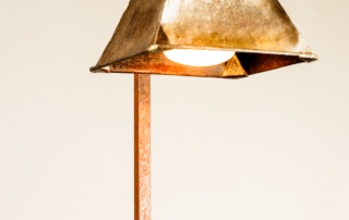 Designer indoor or outdoor lamp called Small Funnel with light on