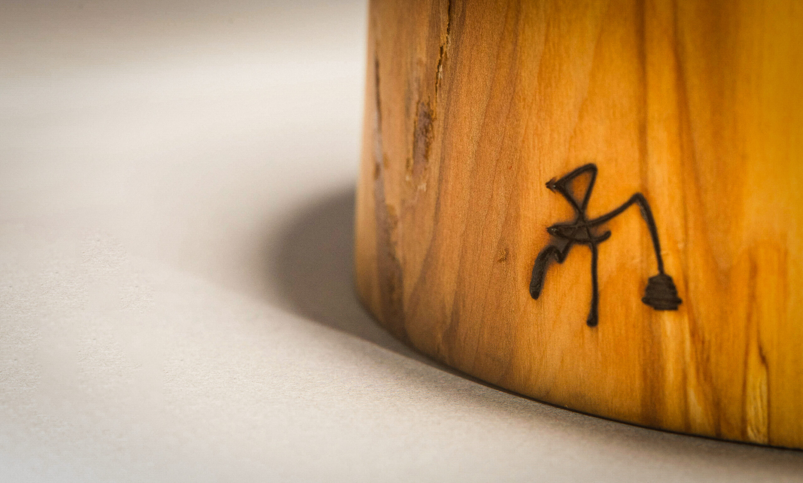 Piece of turned wood and Unperfect Logo